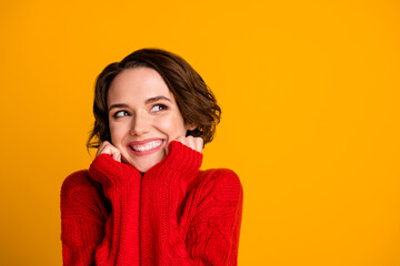 Photo of overjoyed lady enjoy joyful look empty space soft cloth warmth winter holidays dream celebrate miss family wear casual red knitted sweater isolated vivid yellow color background