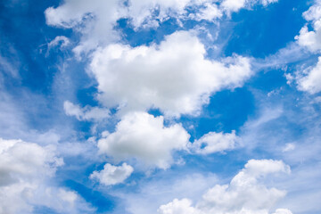 Naklejka na ściany i meble Blue sky with white clouds on a clear sunny day.