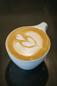 pouring latte cappuccino coffee, in cafe