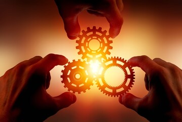 Hands holding three gear wheel