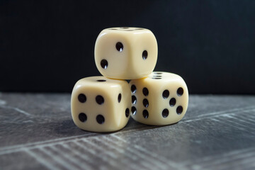Three dice on a black background