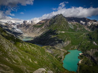 The best scenic view to the valley under the highest mountain Grossglockner with glaciers cover with snow and unique lakes under him in Hohe Tauern national park, near Heiligenblut, Austria, Europe.
