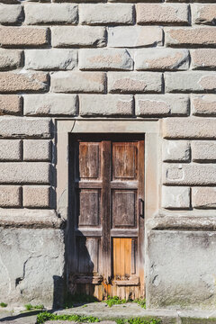 Old Wooden Door on a Stone Wall