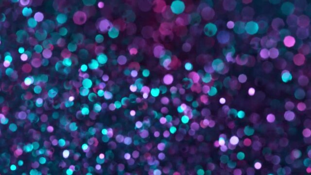 Super Slow Motion Shot of Neon Glitter Background at 1000fps.