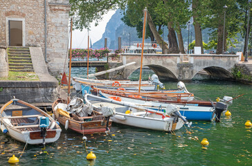 Fototapeta na wymiar Riva del Garda - The little harbor on the waterfront of Lago di Garda lake.