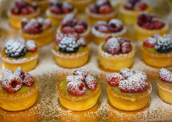 Wild strawberry and raspberry cakes in ancient city of strawberry Nemi, Castelli Romani, Italy