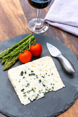 French cheeses collection, piece of roquefort, sheep milk soft blue cheese from Southern France.