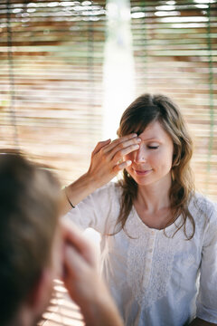Therapist guiding the client in tropical retreat center to EFT (Emotional Freedom Technique)