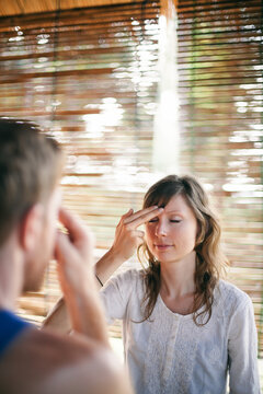 Therapist guiding the client in tropical retreat center to EFT (Emotional Freedom Technique)