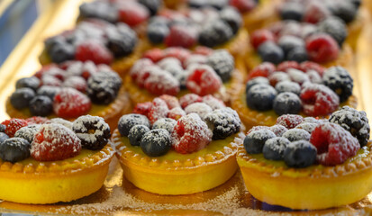 Wild strawberry and raspberry cakes in ancient city of strawberry Nemi, Castelli Romani, Italy