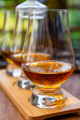 Tasting of Scotch whisky in traditional old British house with wooden windows