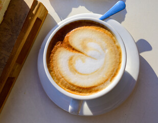 Breakfast coffee, Italian classic cappuccino with milk foam served in cafe