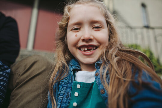Cute young girl having fun smiling outside