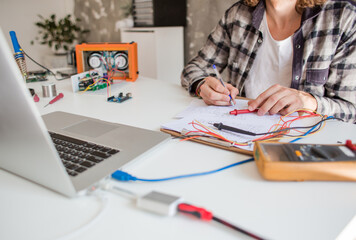 Young engineer student working on a project from home