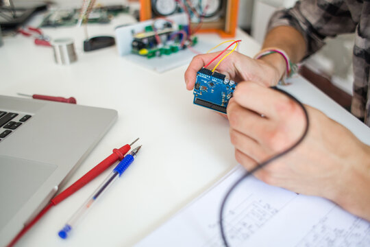 Young engineer student working on a project from home