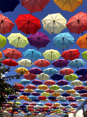 Fototapeta na wymiar colorful umbrellas along the road