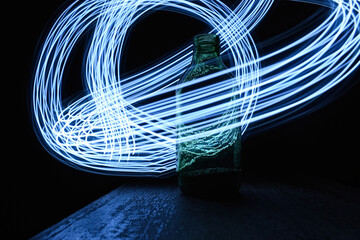 Vertical shot of a bottle and movements of light