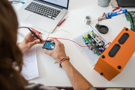 Young engineer student working on a project from home