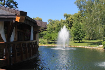 restaurant on the water near the fountain, nature in the park