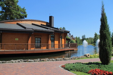 restaurant on the water near the fountain, nature in the park