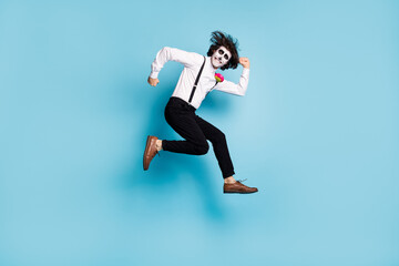 Fototapeta na wymiar Full length body size view of his he handsome funky comic childish cheerful cheery gentleman jumping having fun running fooling calavera fest isolated bright vivid shine vibrant blue color background