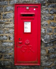 red english letterbox on old wall at cheddar gorge england