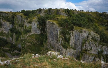 Cliffs of Cheddar Gorge from high viewpoint. High limestone cliffs in canyon in Mendip Hills in Somerset, England