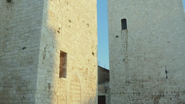 Bisceglie, Puglia, Italy - August 19, 2019: Two of the towers of the Swabian castle of Bisceglie, Apulia. Italy