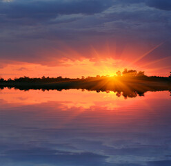 sunset over water surface
