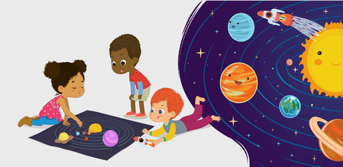 Children sitting on floor explore toy universe, Planets, Stars, Sun, Moon, and Galaxies. Playing and educational activity in kindergarten. Preschool environmental education concept.  