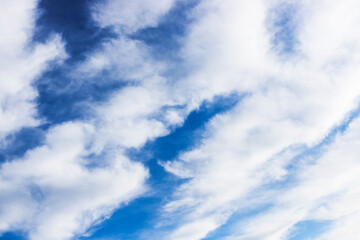 Blue sky with white gray clouds.