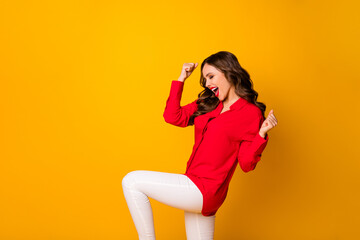 Fototapeta na wymiar Profile photo of crazy wavy lady raise fists rejoicing exciting business startup win competition wear red office shirt white trousers isolated bright vivid yellow color background