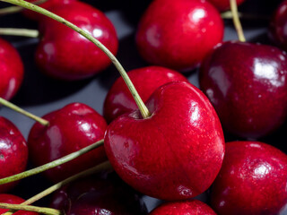 close-up of bright juicy fresh cherries on a dark background. Delicious and healthy berries, healthy food, vegetarianism