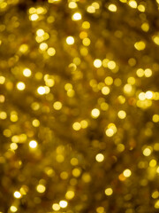 Christmas and new year lights. Blurred lights of Golden color. Can be used as background and texture