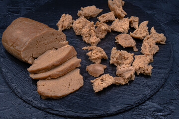Seitan prepared at home out of wheat gluten and tapioca flour, sesame paste and spices, steamed. Copy space.