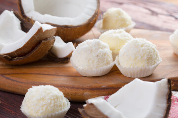 White chocolate candies with coconut topping close up