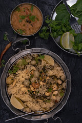 Vegan rice pilaf made with roasted green tomatoes, nuts, seeds, spices