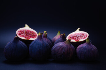 Tasty figs on a black background. Top view.