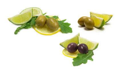 Two olives and piece of lemon and lime isolated on white