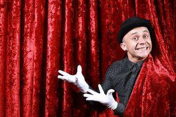 master ceremony on the stage in white gloves at red background