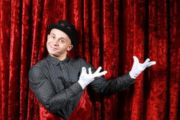 master ceremony on the stage in white gloves at red background