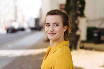 Half-turn portrait of gorgeous woman in yellow