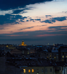 A cityscape of Saint Petersburg in the evening. Rooftop view. Blue hour after the sunset.
Saint Isaac's Cathedral. Cloudy sky. City of Russia. Dusk.