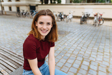 Attentive young woman with a friendly smile