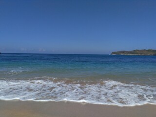 Beautiful scenery of blue beach. Tambakrejo beach, the one of beautiful indonesian beach in Blitar, East Java, Indonesia.