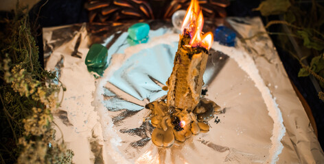 Candle for cleansing a person, magic rituals and wax casting, energy cleansing. Altar of modern witch.