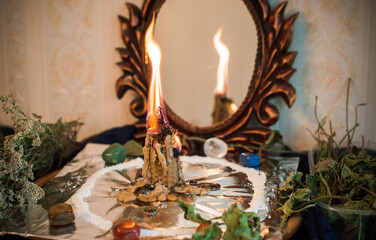 Candle for cleansing a person, magic rituals and wax casting, energy cleansing. Altar of modern witch.