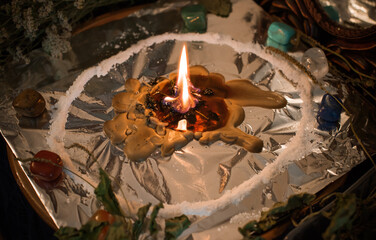 Candle for cleansing a person, magic rituals and wax casting, energy cleansing. Altar of modern witch.