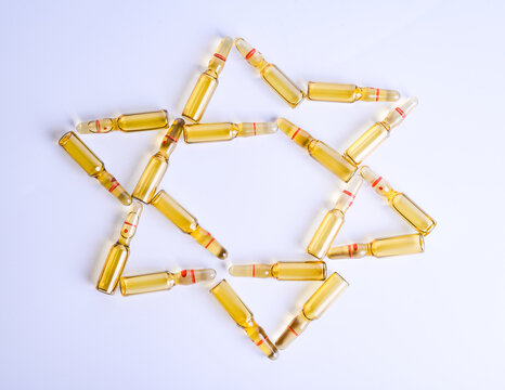 Star of David made from medical ampoules. The concept of vaccination. Coronavirus concept. Israel