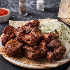 Meat shish kebab on a plate. Closeup.  Grilled meat.
